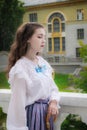 Portrait girl in vintage clothes on terrace of mansion