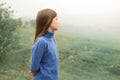 Portrait of girl walking in a foggy morning Royalty Free Stock Photo