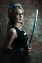 Portrait of a girl warrior with sword. Royalty Free Stock Photo