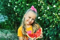 Portrait of a girl with a watermelon in nature Royalty Free Stock Photo