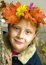 Portrait of a girl wearing a wreath of autumn leav