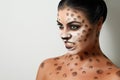 Portrait of a girl on a white background. . face art. body art. hairstyle. black hair. wild cat. growl Royalty Free Stock Photo