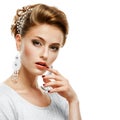 Portrait of a girl in a white dress and jewelry in a high key. Royalty Free Stock Photo