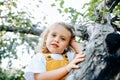 Portrait of girl who climbed tree