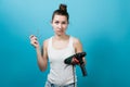 Portrait of a girl who does not understand how to use a drill. A male tool Royalty Free Stock Photo