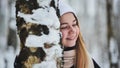 Portrait of a girl in winter in a birch forest. Royalty Free Stock Photo