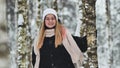 Portrait of a girl in winter in a birch forest. Royalty Free Stock Photo
