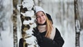 Portrait of a girl in winter in a birch forest. Royalty Free Stock Photo