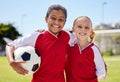 Portrait of girls on field, sports and soccer player, smiling with teammate. Soccer ball, football and young kids having Royalty Free Stock Photo