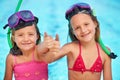 Portrait, girls and happy kids with thumbs up at swimming pool, sisters or family of siblings in swimsuit outdoor