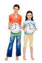 Portrait of girls holding clocks