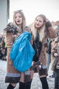 Portrait of girls person parading in the street throwing confetti