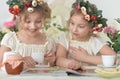 Portrait of girls reading magazine, and drinking tea Royalty Free Stock Photo