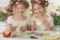 Portrait of girls reading magazine, and drinking tea Royalty Free Stock Photo