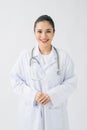 Portrait of glad smiling doctor in white uniform standing with crossed hands on white background