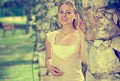 Portrait of glad young blond woman in garden Royalty Free Stock Photo