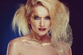 Portrait of a glamorous blonde girl with beautiful Golden makeup Royalty Free Stock Photo