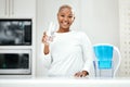 Portrait, glass and black woman drinking water, detox and health with nutrition, happiness and wellness. Face, female