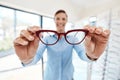 Portrait, glasses and woman with poor vision trying out a new pair at optometrist. Eyeglasses, spectacles and shopping Royalty Free Stock Photo