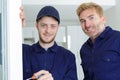 portrait glazed window installers posing Royalty Free Stock Photo