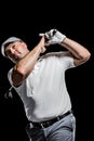 Portrait of golf player taking a shot Royalty Free Stock Photo