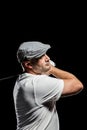 Portrait of golf player taking a shot Royalty Free Stock Photo