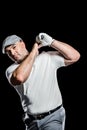 Portrait of golf player taking a shot Royalty Free Stock Photo