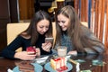 Portrait of good friends in a cafe with dessert