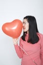 Portrait looking asian woman balloons