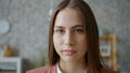 Portrait of good-looking girl looking at camera standing alone at home