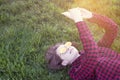 Sweet lady in bright outfit with phone in park Royalty Free Stock Photo