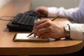 Portrait of good-looking young man entrepeneur working in house