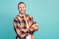 Portrait of good mood handsome guy with beard long hairdo wear flannel shirt hold arms folded isolated on turquoise Royalty Free Stock Photo