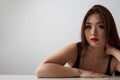 Close-up portrait of gorgeous asian woman with long dark hair looking at camera, isolated over white background. Royalty Free Stock Photo