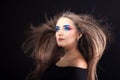 Portrait of a gorgeous beautiful girl with long hair and blue smoky eyes. Royalty Free Stock Photo