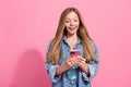 Portrait of gorgeous excited girl wear trendy clothes use modern telephone iphone reading facebook news  on pink Royalty Free Stock Photo