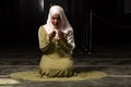 Portrait of a gorgeous humble Muslim woman praying in peace at a mosque