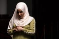 Portrait of a gorgeous humble Muslim woman praying in peace at a mosque