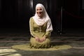 Portrait of a gorgeous humble Muslim woman praying in peace at a mosque