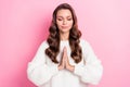 Portrait of gorgeous nice person closed eyes arms palms meditate pray isolated on pink color background