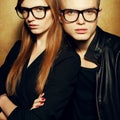 Portrait of gorgeous red-haired fashion twins in black clothes Royalty Free Stock Photo