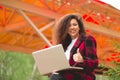 Portrait of gorgeous, smiling young girl using laptop computer at workplace Royalty Free Stock Photo