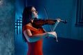 Portrait of gorgeous woman violinist playing beautiful music Royalty Free Stock Photo