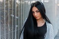 Portrait of a gorgeous young brunette woman with long hair with blue beautiful eyes and natural make-up Royalty Free Stock Photo