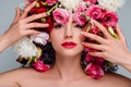 portrait of gorgeous young woman with flowers on head looking at camera Royalty Free Stock Photo