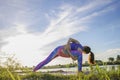 Portrait of gorgeous young woman practicing yoga with nature background Royalty Free Stock Photo