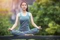 Portrait of gorgeous young woman practicing yoga with nature background Royalty Free Stock Photo