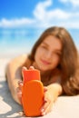 Portrait of gorgeous young woman smiling while relaxing on beach Royalty Free Stock Photo