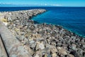 Portrait graffiti art of famous artists, musicians and singers on stones of breakwater in the Santa Cruz de Tenerife. Editorial Royalty Free Stock Photo