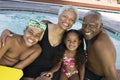 Portrait Of Grandchildren With Grandparents By Swimming Pool Royalty Free Stock Photo